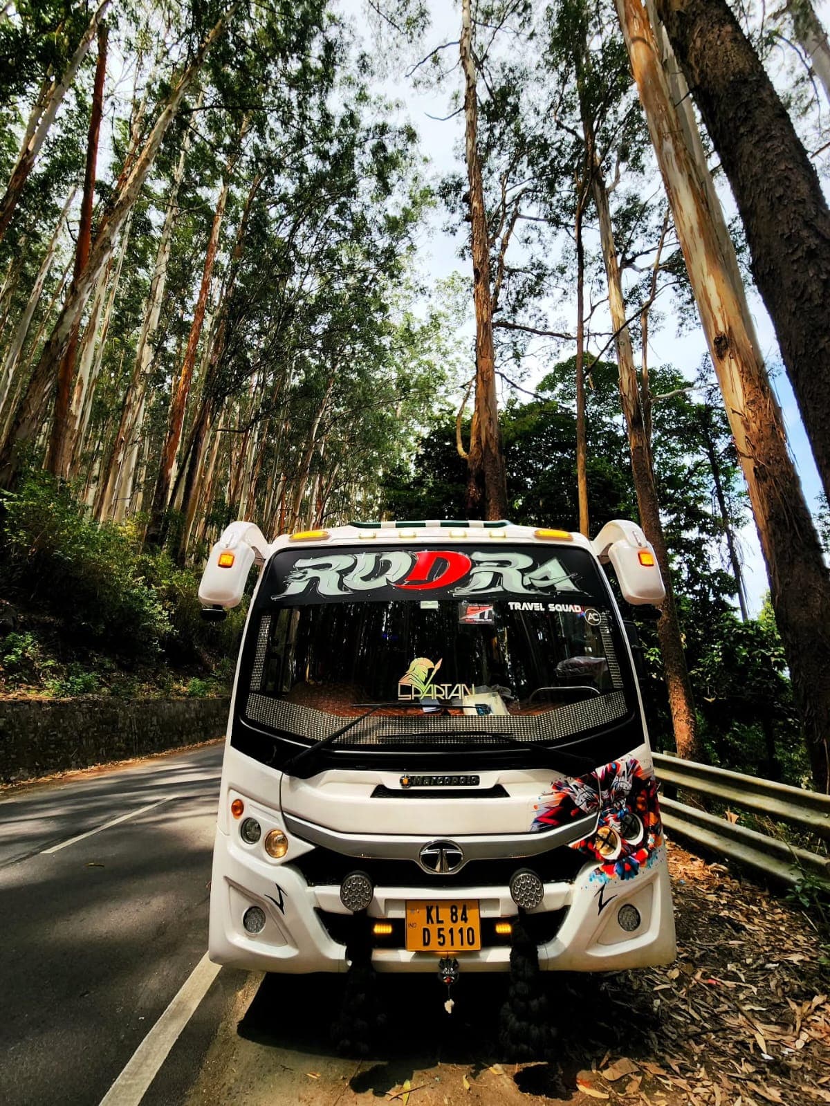 MemorableDayz tourist coach on a scenic South India hill road